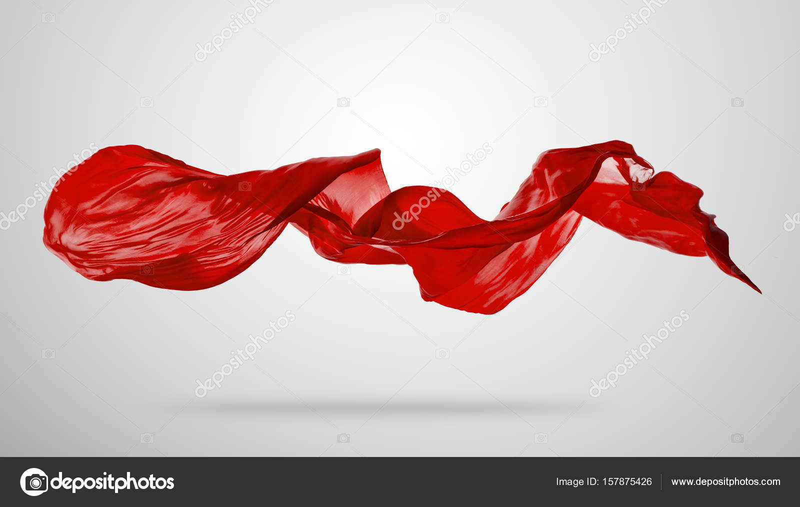 Smooth elegant red cloth on grey background Stock Photo by ©jag_cz